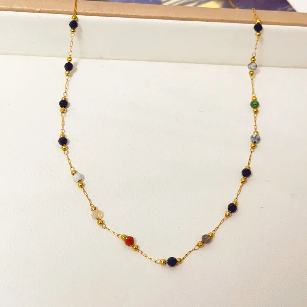 Women's gold titanium steel necklace with a simple natural stone pendant on an O-ring chain.