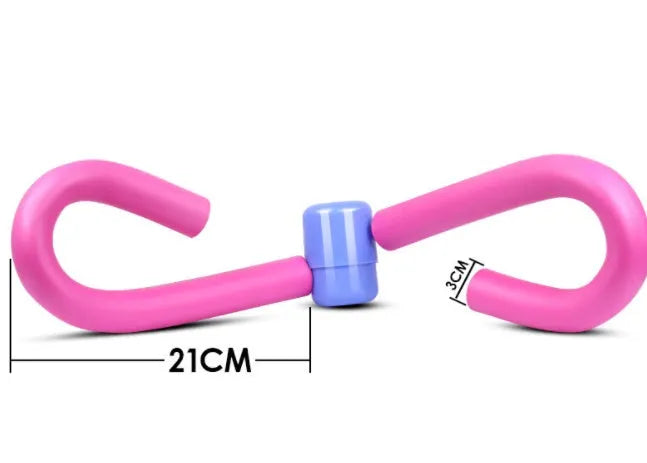 Pink PVC and foam leg exercise machine with steel spring for arm and thigh workouts.