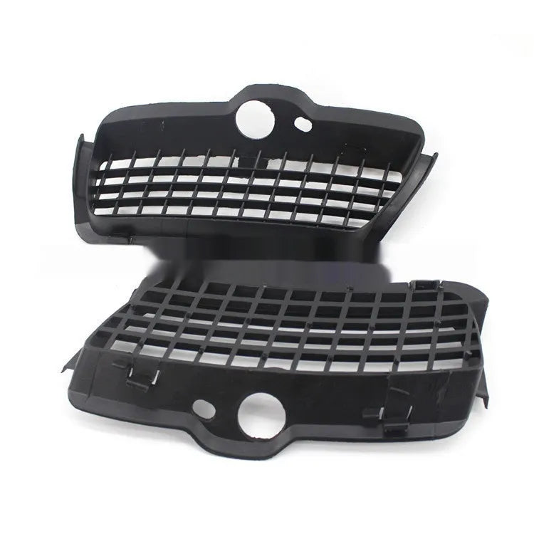 Pair of black ABS plastic Volkswagen Golf 3 front bumper fog light covers.