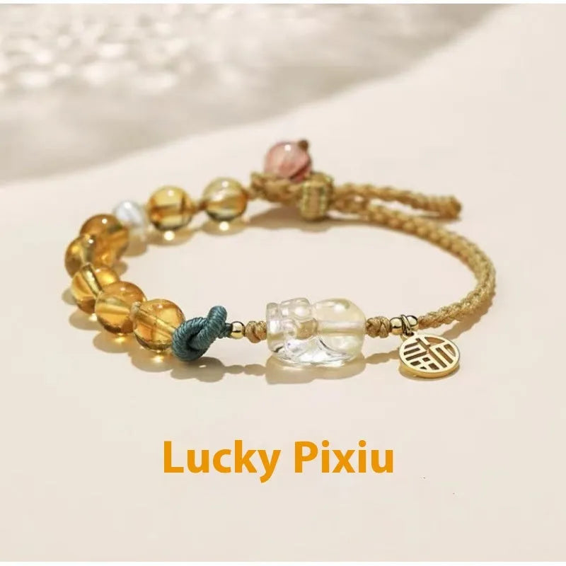 Hand-woven crystal bracelet with animal zodiac design in citrine colour