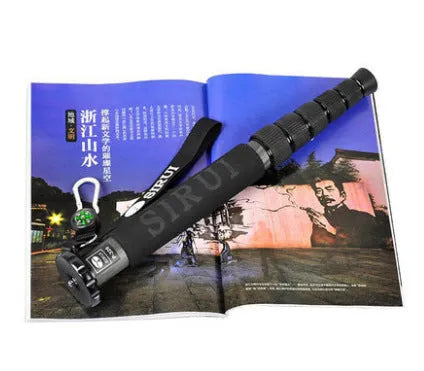 Black carbon fibre monopod for SLR cameras showing telescopic sections extended to 1540mm maximum height
