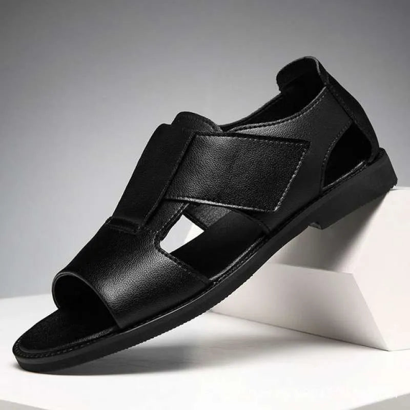 Men's black leather sandals with open-toe design and non-slip rubber soles on a beach background