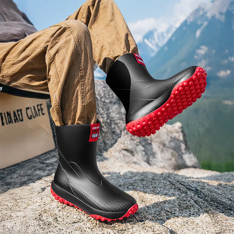 Men's mid-height PVC rain boot in beige with round toe and plastic sole.