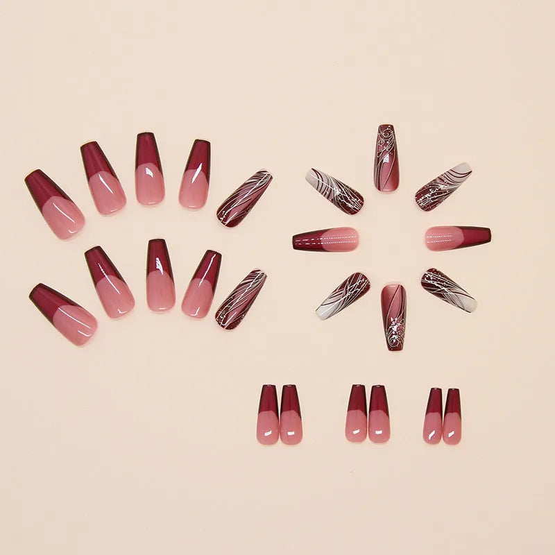 Pack of 24 French line pattern false nail stickers and glue tube on a white background.