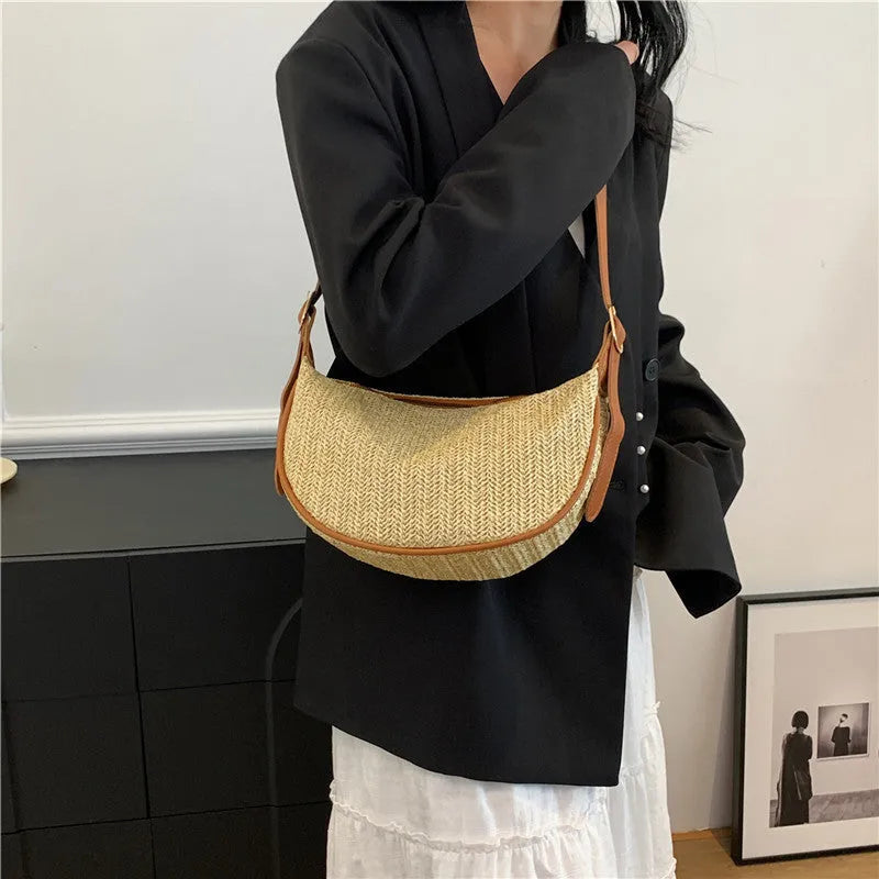 Women's woven straw crossbody bag showing internal phone and file compartments in corrugated brown colour