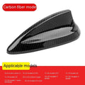 BMW shark fin antenna cover in carbon fibre and piano black finishes on a car roof.