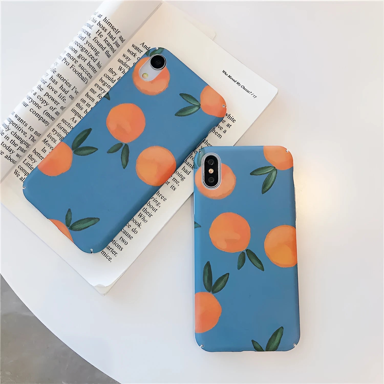 Bright orange plastic iPhone case with a retro water and blue background design
