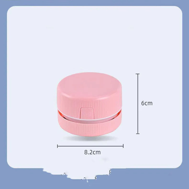 Portable mini desktop vacuum cleaner in pink or blue for pencil eraser chip cleaning