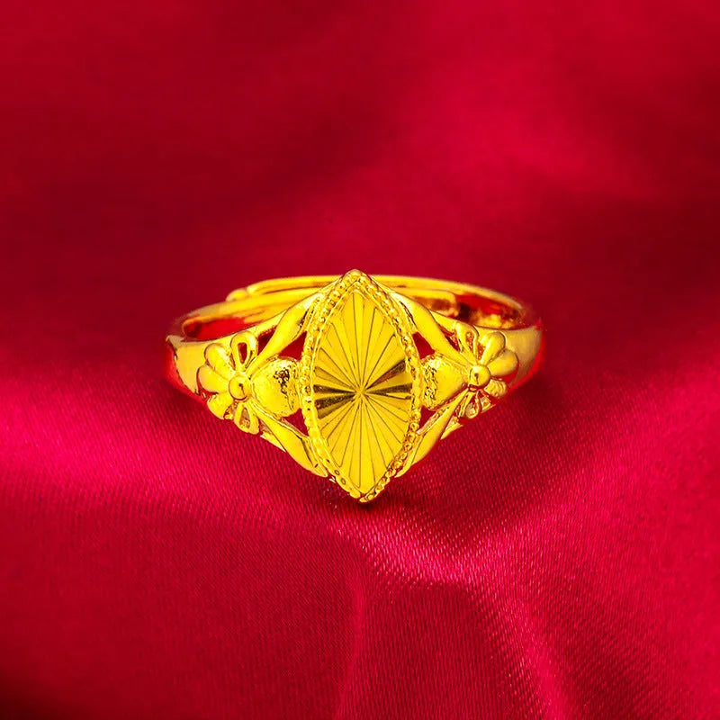 Gold geometric flower ring with textured surface and open adjustable band design
