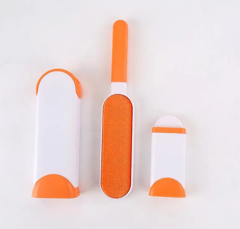 Blue reusable pet hair removal comb with double-sided flannel brush next to its self-cleaning base unit.