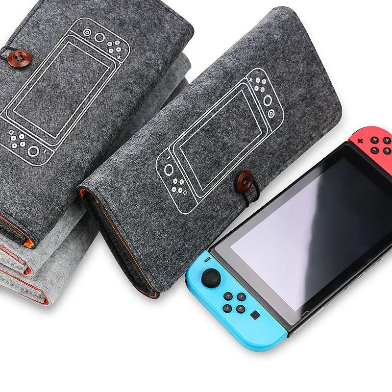 Black felt carrying pouch case for Nintendo Switch console with game card slots open.