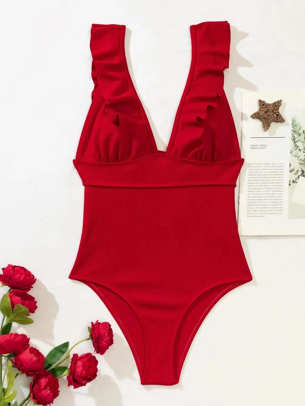 Women's black one-piece swimsuit with ruffled shoulder straps and an adjustable lace-up back closure.