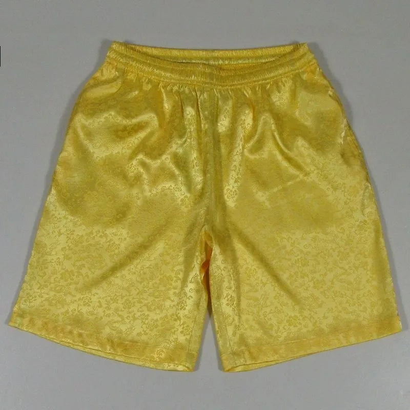 Men's black Tang Suit Shorts with elastic waistband, shown for Tai Chi practice