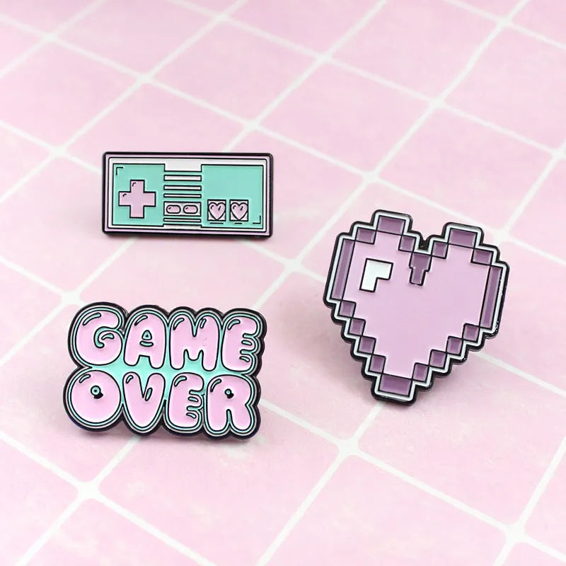Three-dimensional alloy game console badge in metallic finish with mounting points