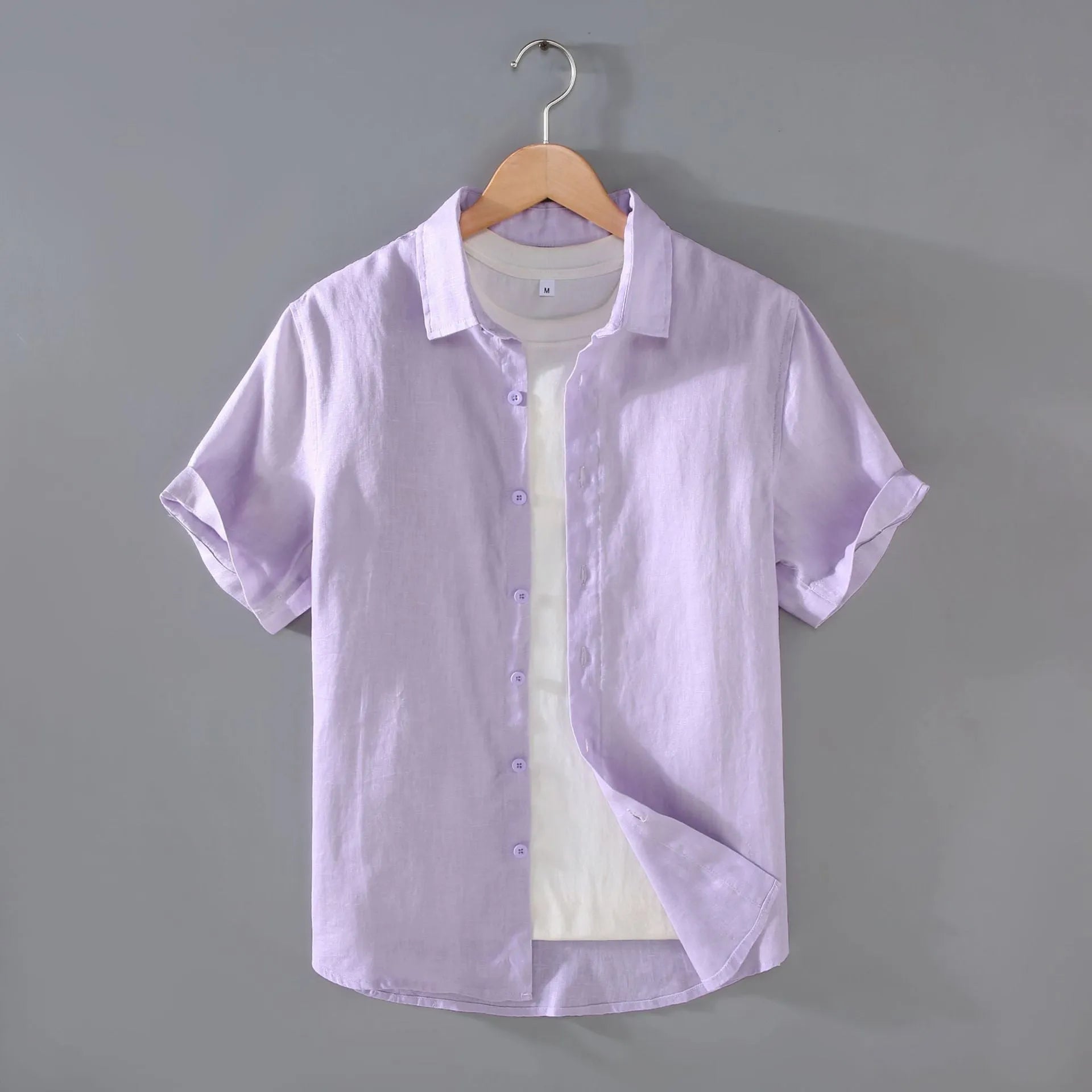 Men's grey linen short-sleeved casual shirt with a regular fit and cardigan style on a hanger