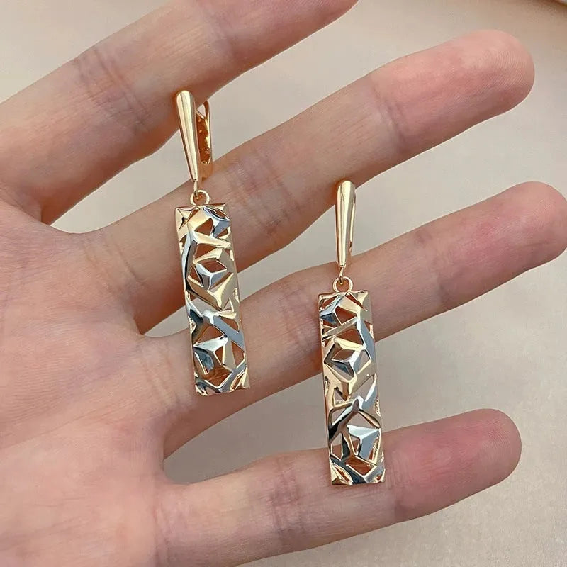 Rectangular two-tone hollow stud earrings for women with a geometric electroplated alloy design.