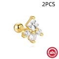 Close-up of women's sterling silver flower stud earrings with square gravel texture in a gold colour.
