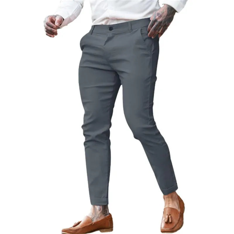 Men's slim fit pencil trousers in stretch cotton twill fabric, shown in a solid colour with a zip fly and mid-waist design.
