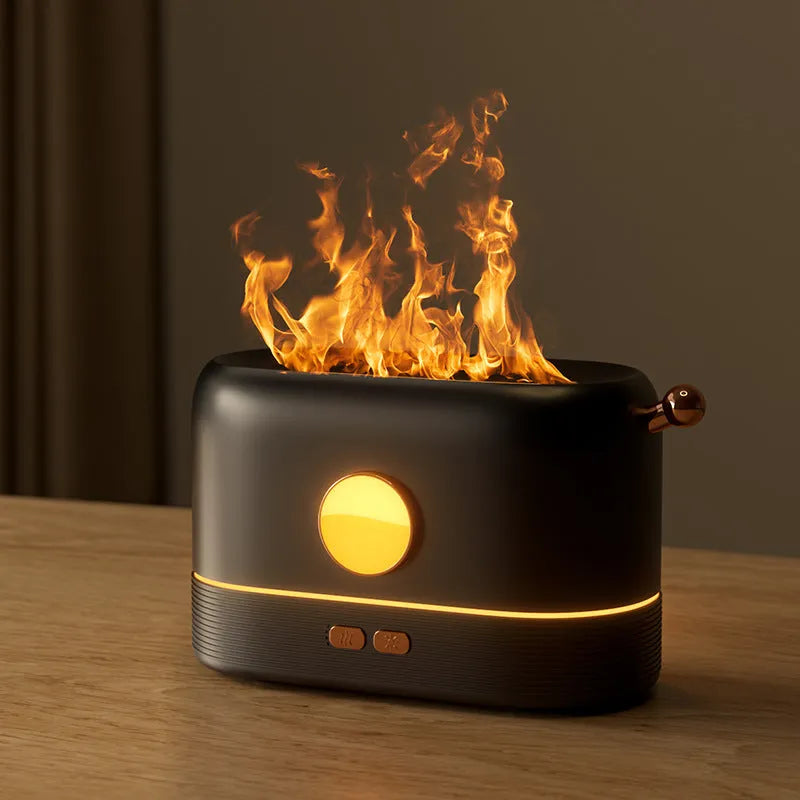 Black USB humidifier with flame simulation effect on wooden desk, showing mist output and compact 15cm height