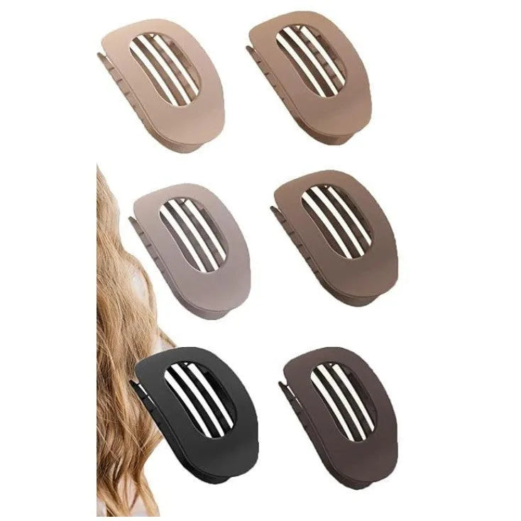 Six rose red plastic hair clips with frosted surface and quadrilateral shape arranged on white background
