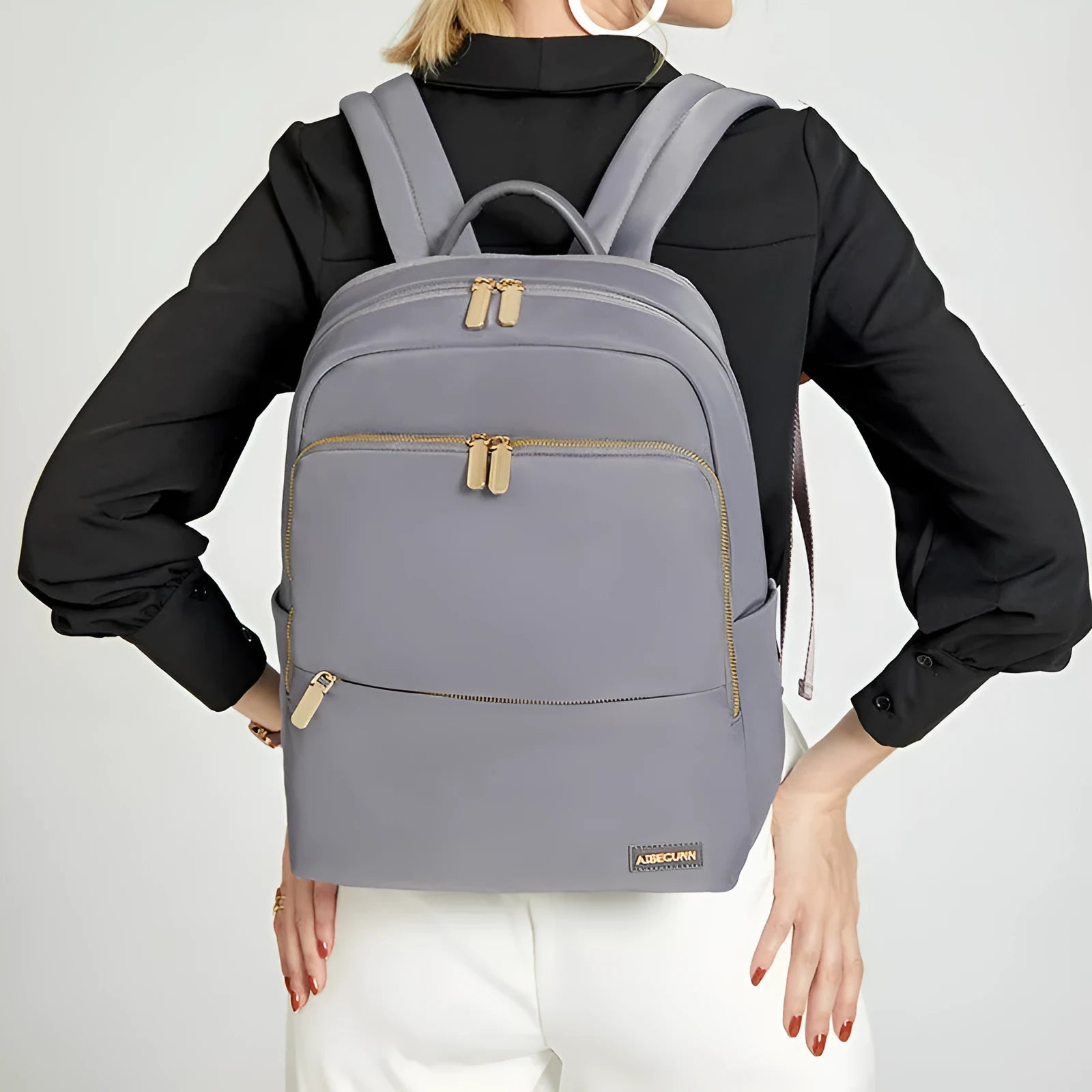 Classic black women's Oxford cloth backpack with large main compartment and breathable back panel.