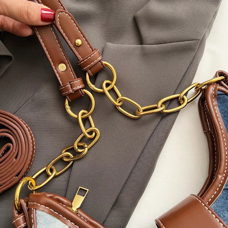 Brown denim women's bucket shoulder bag with diamond mesh detail, chain accents, and double adjustable straps