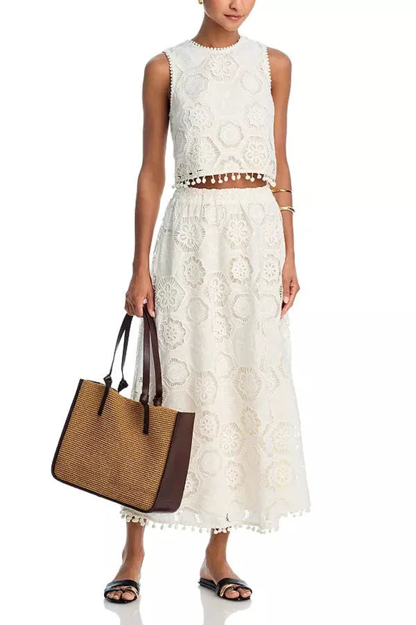White women's suit with sleeveless top and long skirt featuring embroidery details in retro style