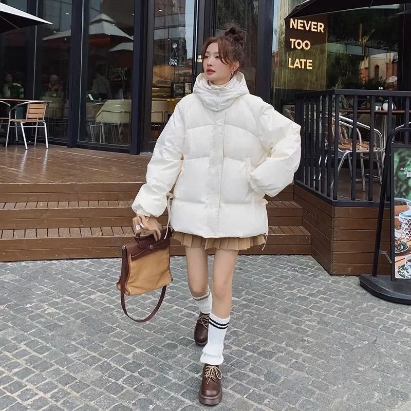Milky white women's sleeveless loose cotton-padded jacket with princess sleeves on a hanger.