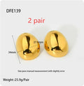 Geometric ear studs with 18K gold electroplating and exaggerated glazed surface showing linear design elements