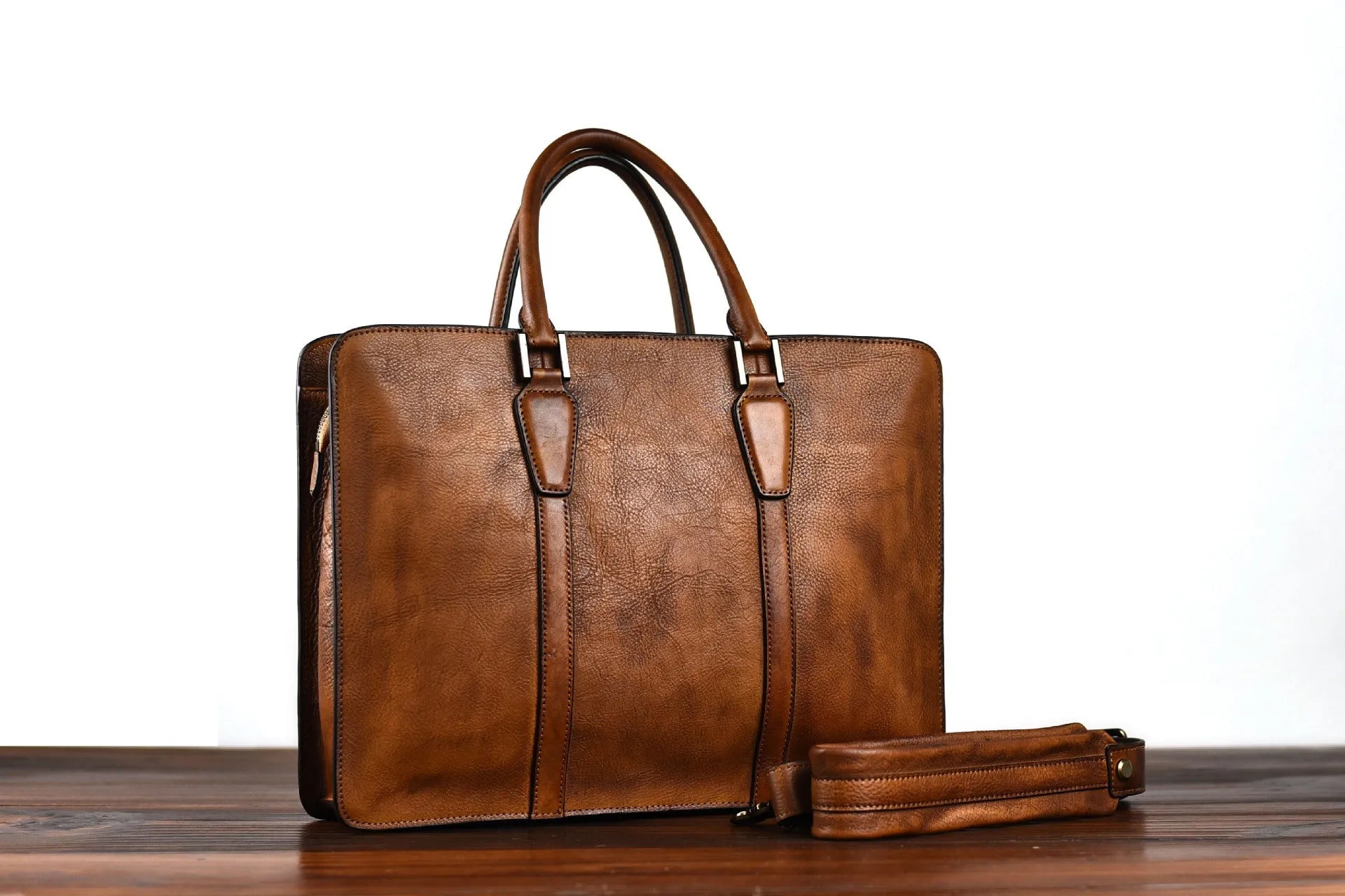 Men's 14-inch horizontal leather handbag with zipper opening in khaki colour, showing vegetable-tanned cowhide texture
