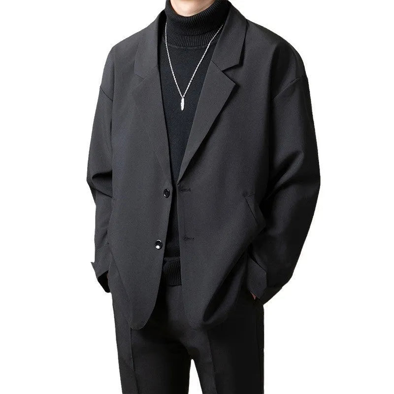 Casual loose fit suit jacket in chemical fibre blend, shown in one of four colours with regular length and long sleeves.