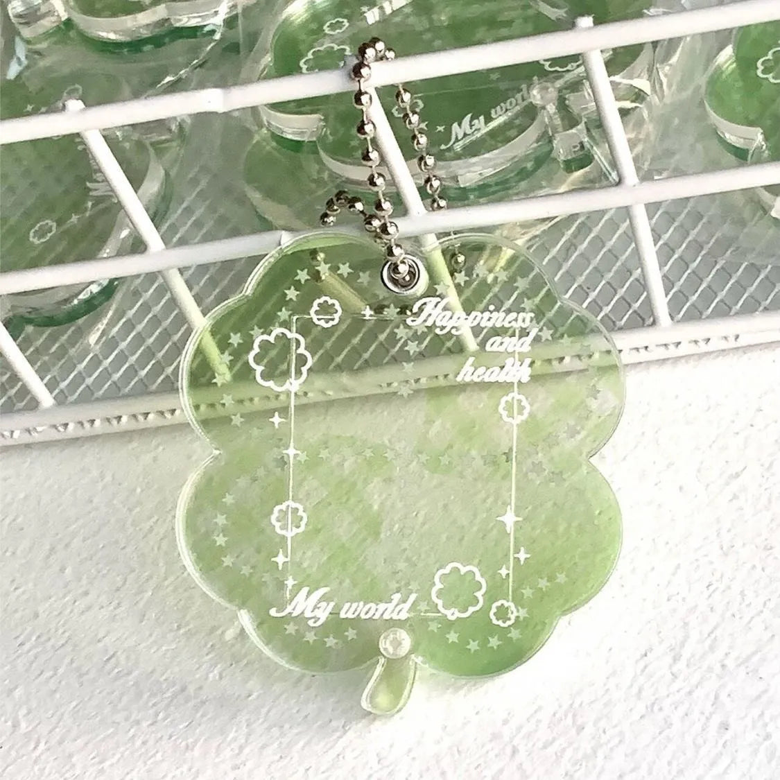 Blue, green, and mint green four-leaf clover acrylic phone pendant keychain.