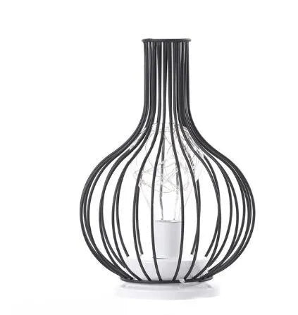 Minimalist hollow iron table lamp in a red wine bottle style with warm white LED light.