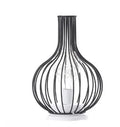 Minimalist hollow iron table lamp in a red wine bottle style with warm white LED light.