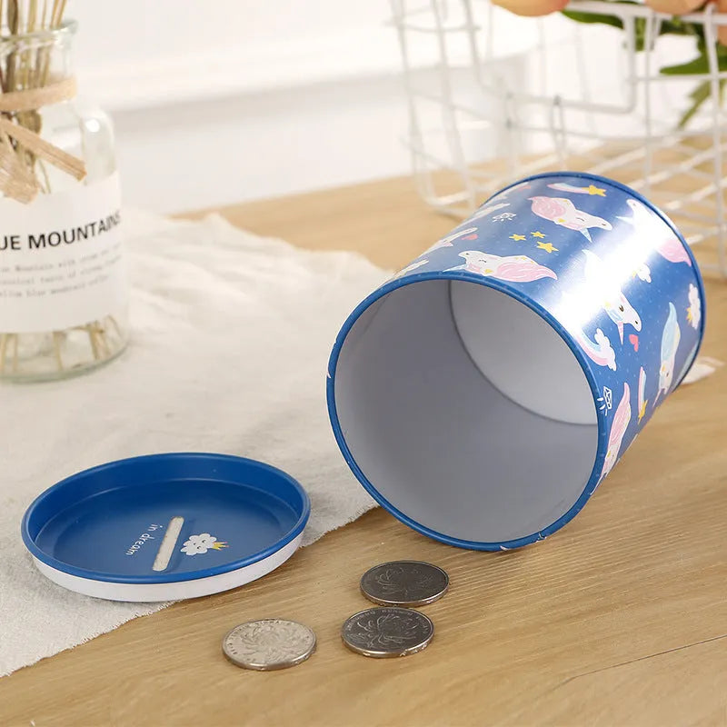 British style creative metal piggy bank for coin savings on a wooden desk.