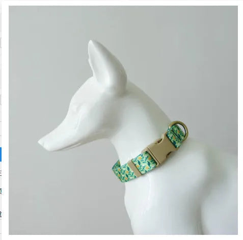 Flower patterned nylon pet collar in Hanada colour, showing adjustable fastening and floral design detail.