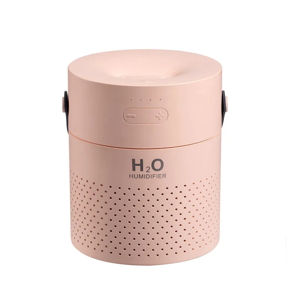 Slim green USB-rechargeable bedroom humidifier with dual mist nozzles and LED light on a wooden surface.