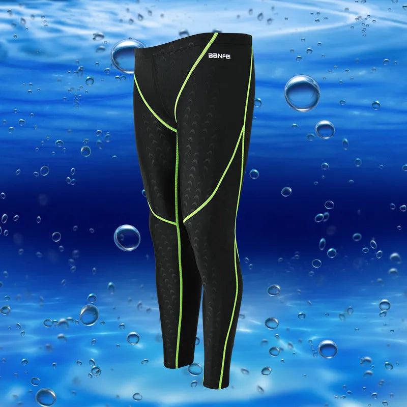 Men's black and green line nylon cropped swimming trunks on a white background.