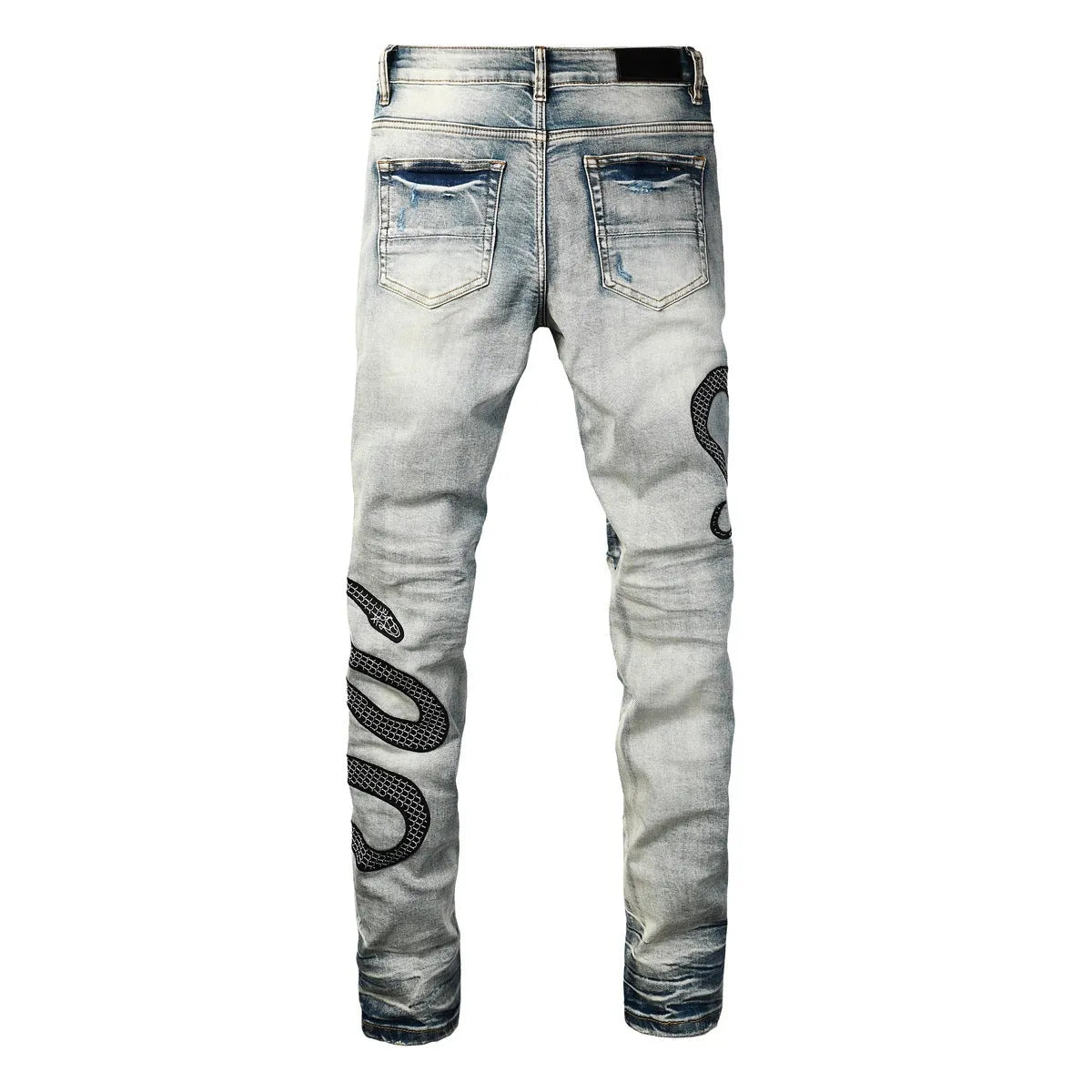 Blue distressed skinny jeans with a button fly on a mid-rise waist.