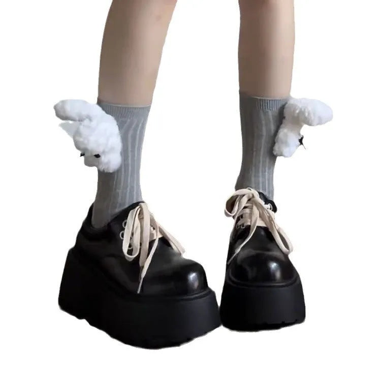 Women's matte black lace-up shoes with a 6-8cm English muffin heel and round toe on a solid background