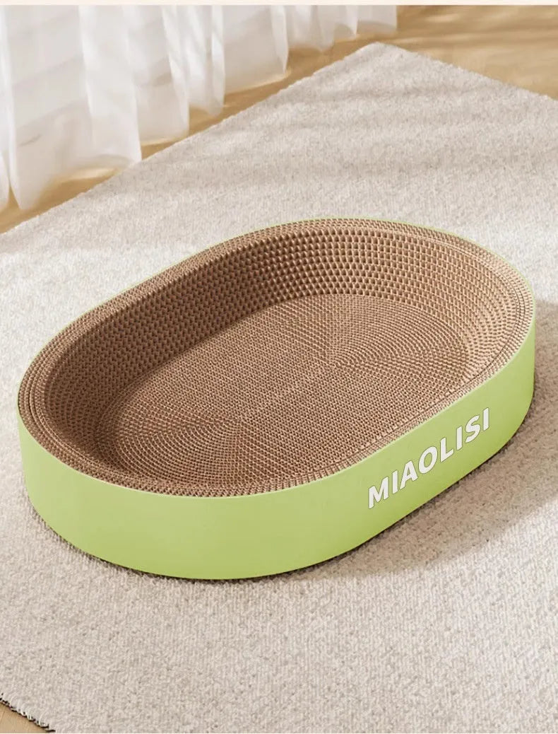 Green 55cm oval cat scratch board made from corrugated paper, showing textured scratching surface