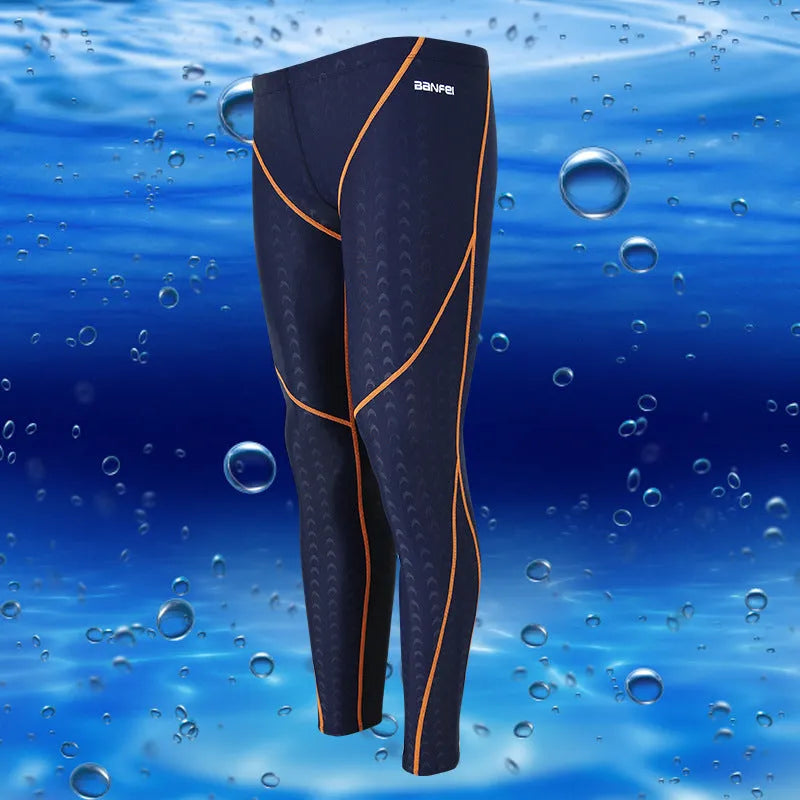 Men's black and green line nylon cropped swimming trunks on a white background.