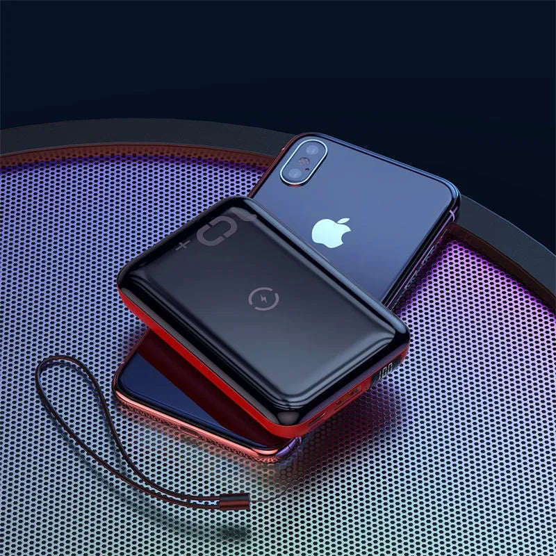 Small square black wireless fast charge power bank with LED digital display showing battery percentage