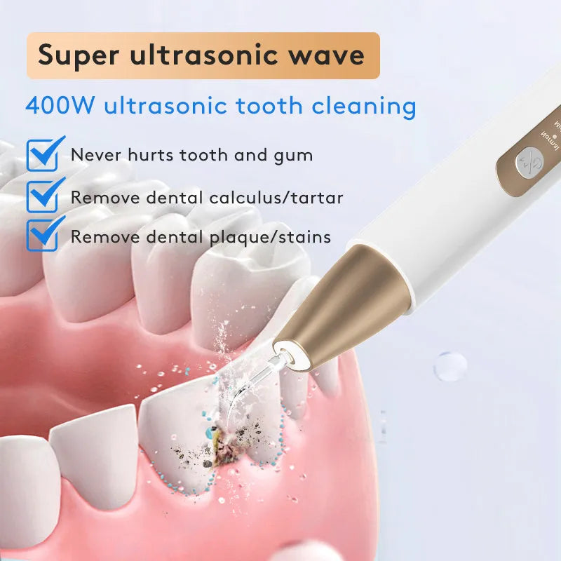 Gold ultrasonic tooth cleaner with three cleaning heads on charging cable next to storage case