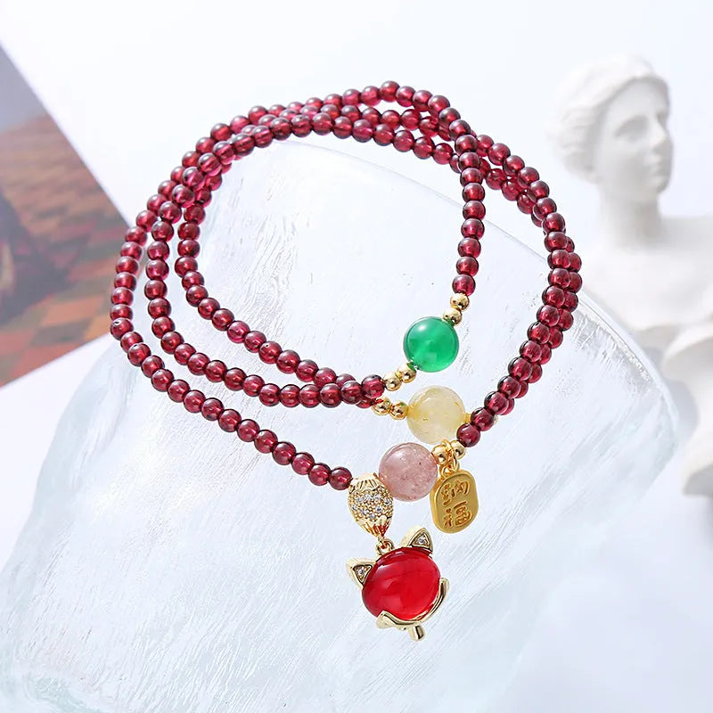 Purplish red garnet fox charm adjustable bracelet for women on rope cord