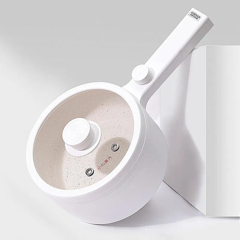 White or green portable electric hot pot cooker with multi-function controls on a countertop.