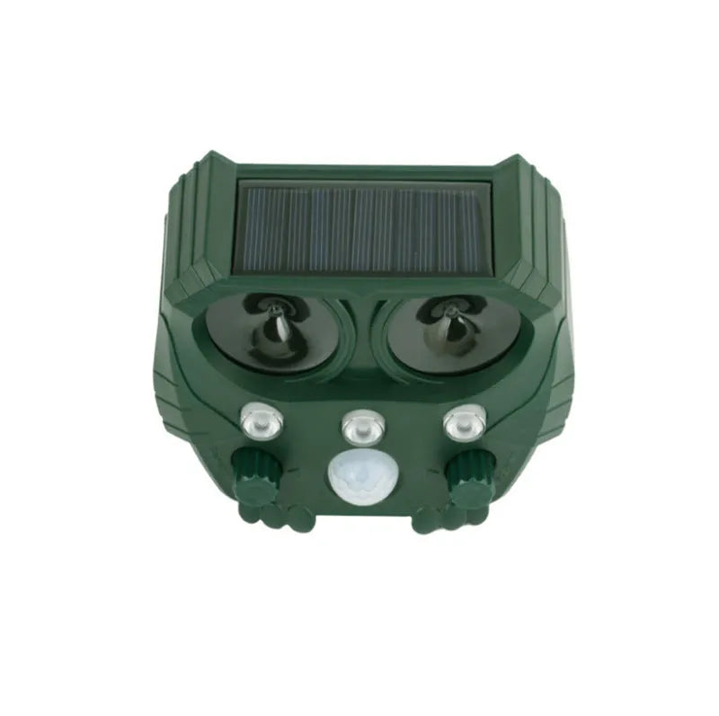 Green solar ultrasonic dog repeller with solar panel, measuring 12x13x5cm for outdoor pest control