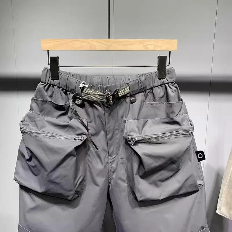 Men's black workwear shorts with loose fit, pockets, and non-ironing fabric, sized for waists up to 115kg