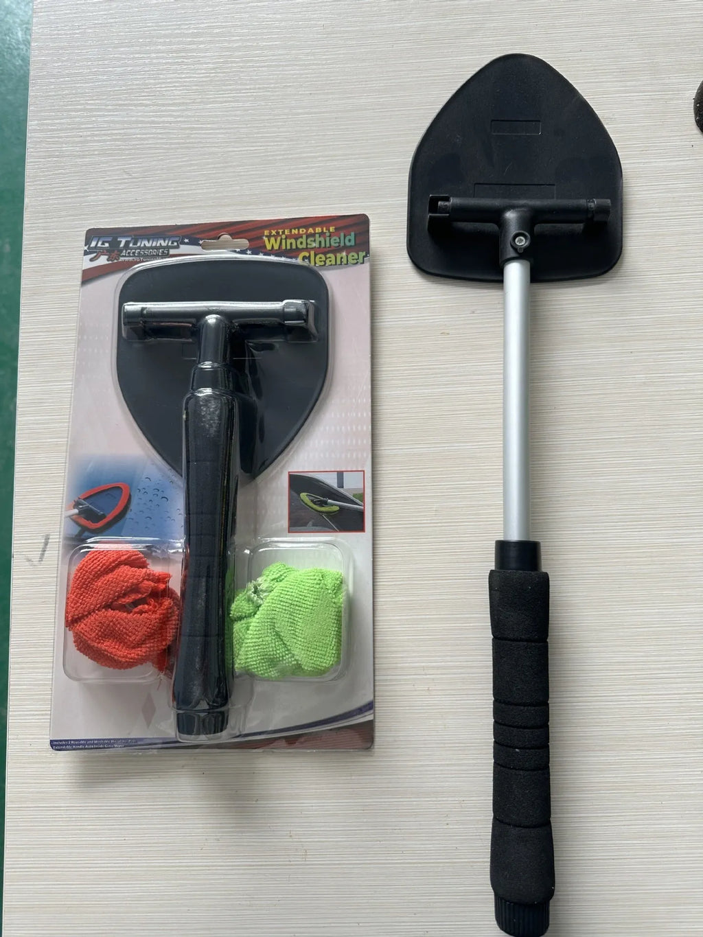 Plastic car windshield cleaning brush in red, green and sapphire blue colours