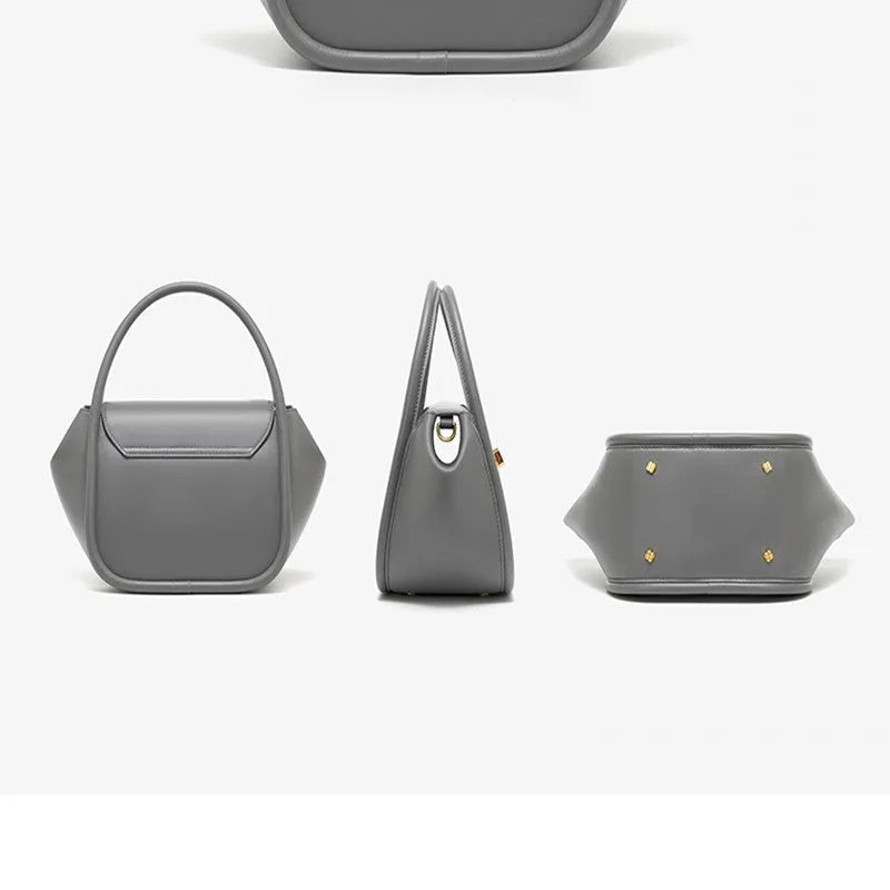 Leather tote cross-body wing bag in soft cow leather with latch closure and wing shape design.